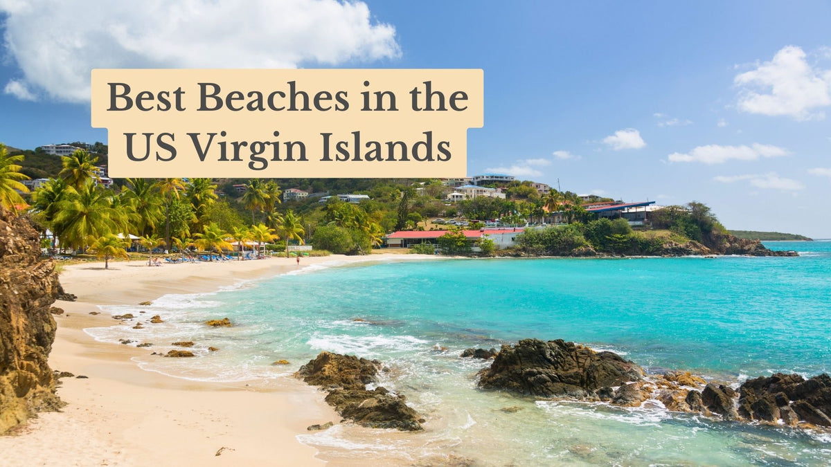 Title card "Best Beaches in the US Virgin Islands" over a sandy cove with turquoise water, rocks, palm trees and hillside buildings.