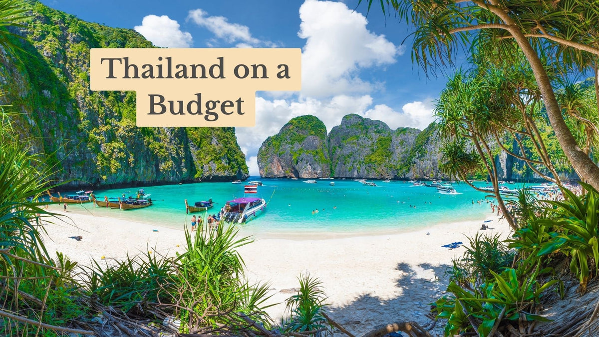 Cover reading "Thailand on a Budget" over a turquoise bay with boats, white sand beach and green limestone cliffs