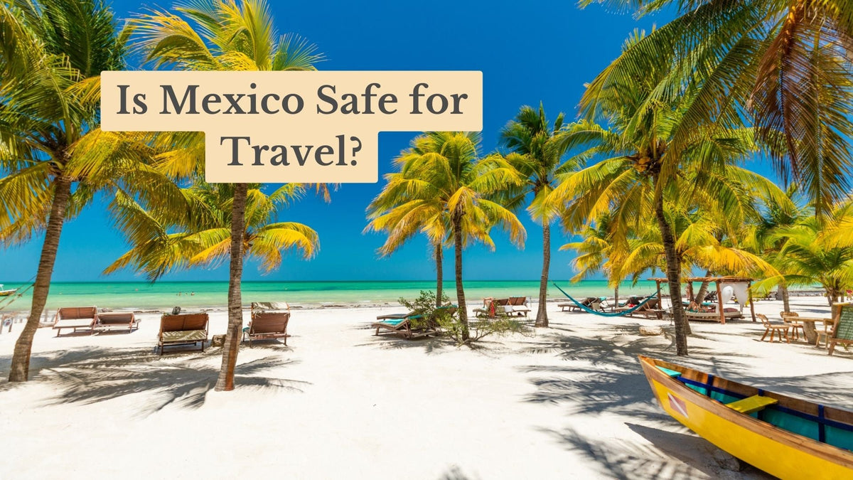 Palm trees, lounge chairs and a yellow boat on a white sand beach by turquoise water, with the text "Is Mexico Safe for Travel?"