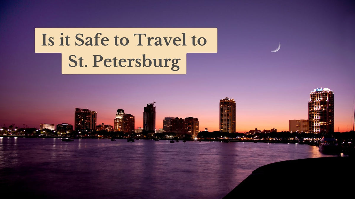 Title card "Is it Safe to Travel to St. Petersburg" over a lit waterfront skyline at dusk with a crescent moon in a purple sky.