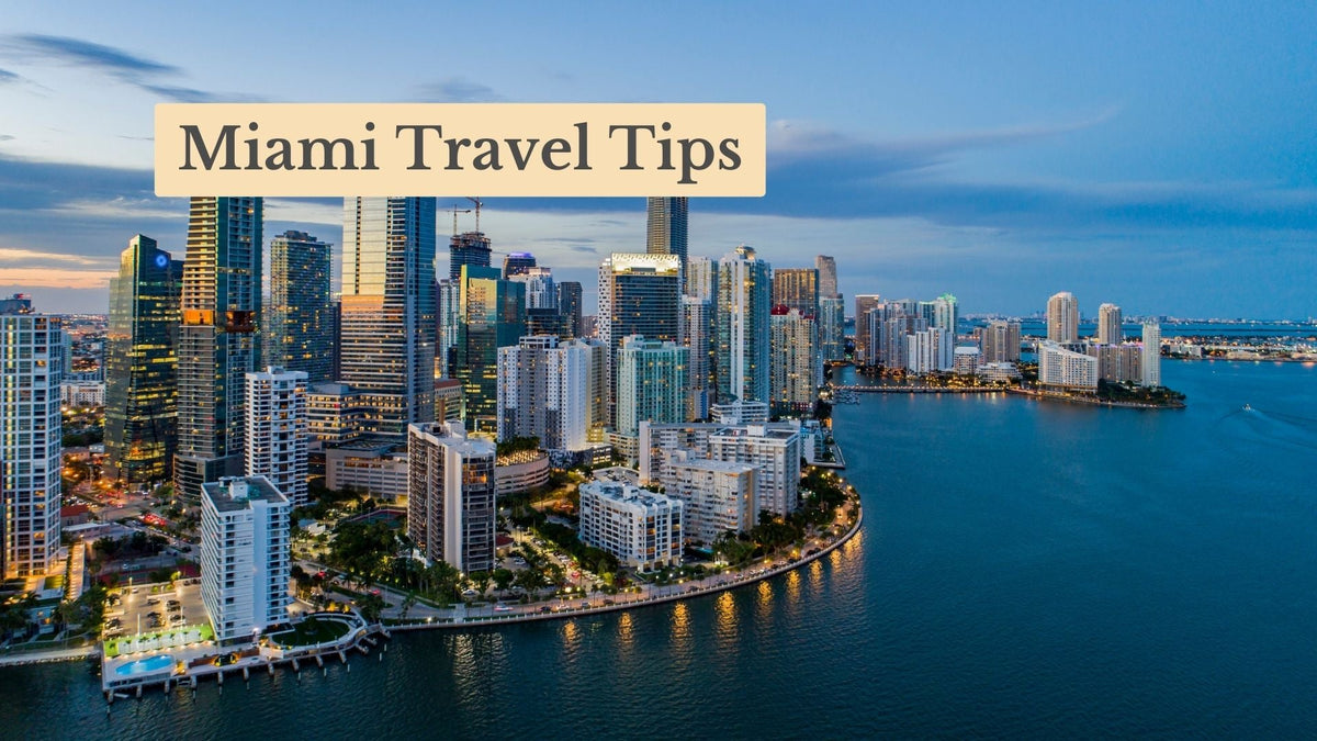 Miami Travel Tips title over an aerial view of the Miami skyline and waterfront towers at dusk