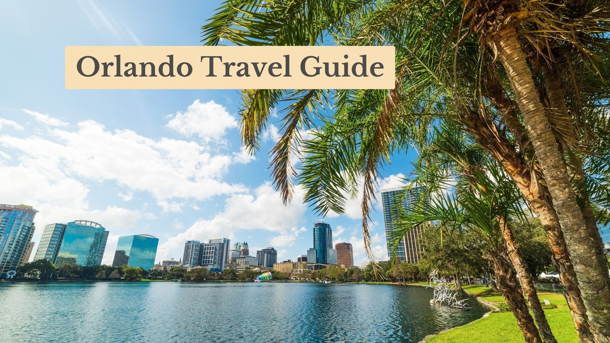 Orlando Travel Guide cover: palm trees frame a sunny lake with the downtown skyline of glass towers behind it