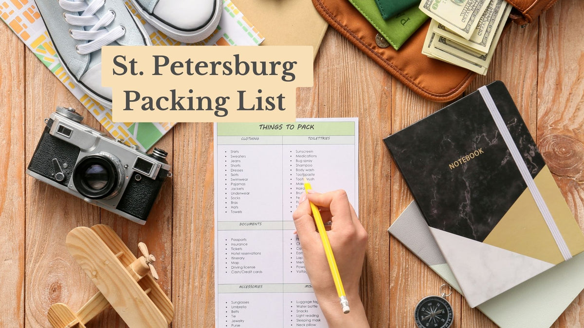 St. Petersburg Packing List cover: a hand fills in a "Things to Pack" checklist, surrounded by a camera, sneakers, cash, a notebook and a toy plane.