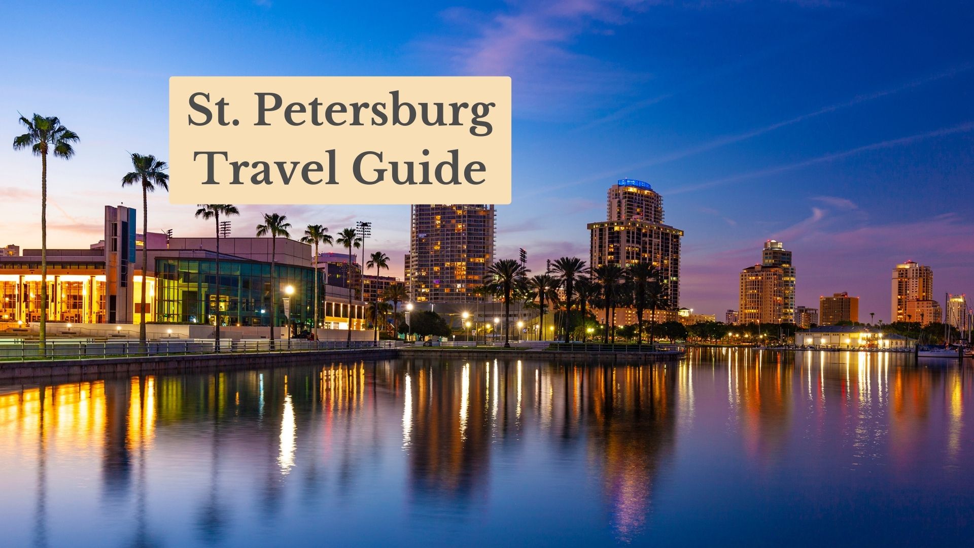 St. Petersburg Travel Guide cover: lit waterfront buildings and palm trees reflected in calm water at dusk.
