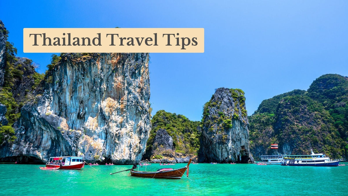 Thailand Travel Tips title over a longtail boat and ferries on turquoise water beside tall limestone cliffs