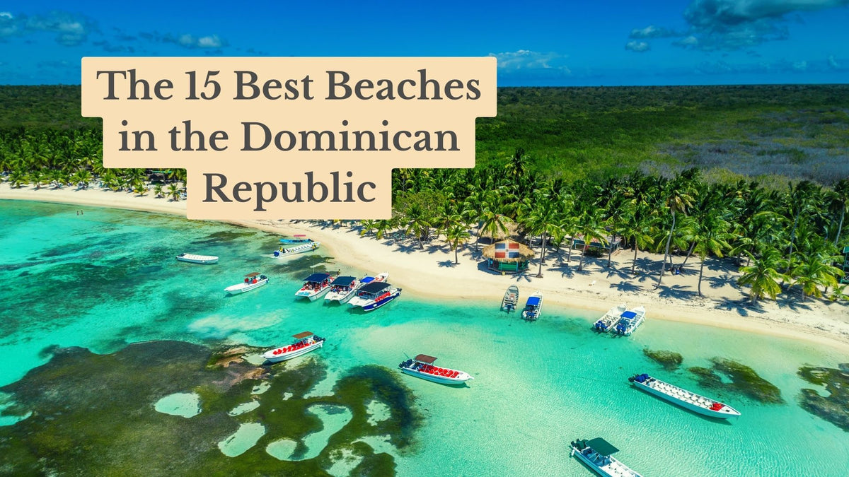Aerial view of turquoise water, moored boats and a palm-lined white sand beach, with the title "The 15 Best Beaches in the Dominican Republic"