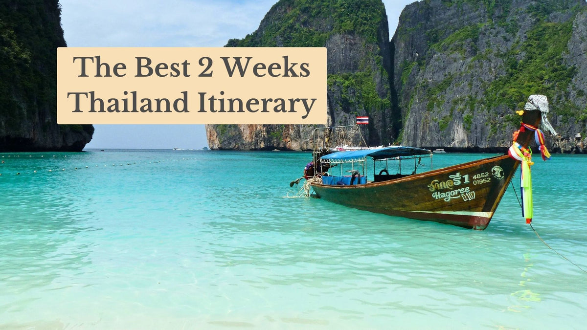 Title card "The Best 2 Weeks Thailand Itinerary" over a longtail boat with ribbons on turquoise water below steep green cliffs