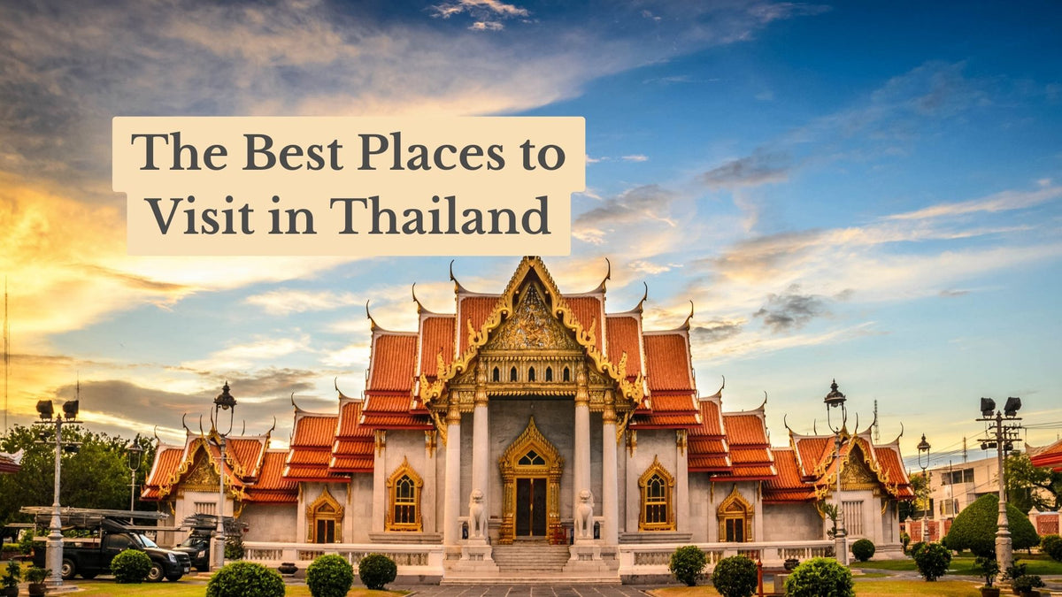 Ornate Thai temple with orange tiled roofs and gold trim under a blue sky at sunset, titled "The Best Places to Visit in Thailand"