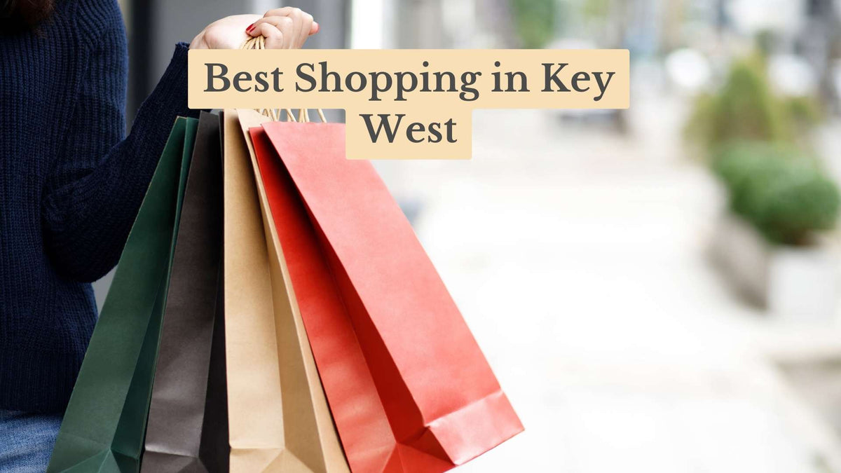 Shopper in a navy sweater holding green, brown, tan and red paper shopping bags, with the title "Best Shopping in Key West"