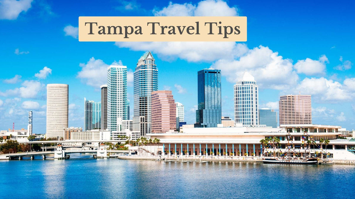 Cover banner reading "Tampa Travel Tips" over the Tampa skyline, with tall towers across blue harbor water under a bright sky